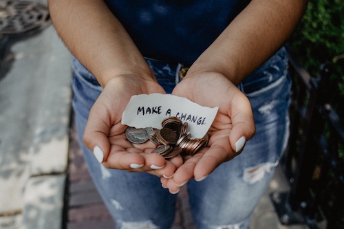 woman holding change